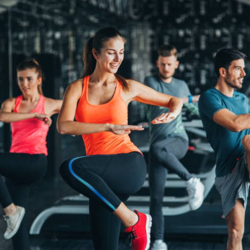People exercising at the gym. People exercising at the gym.